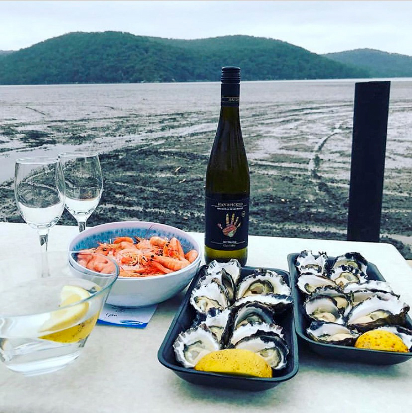 Wine and prawn on a beach